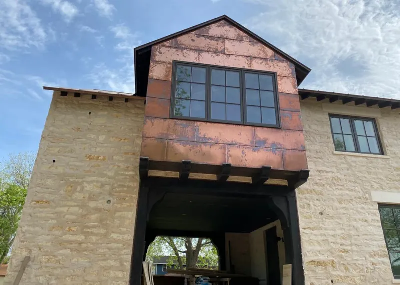 Copper metal panel facade on a stone building for Skylight Installation in Burbank