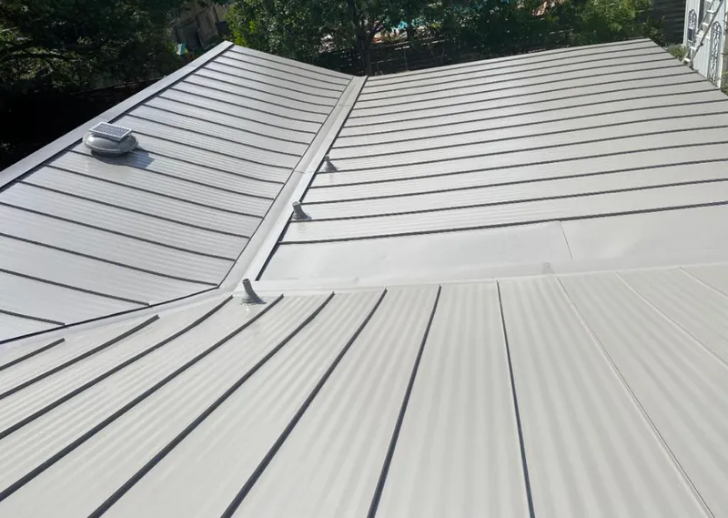 Solar attic fan installed on a metal roof for Roof Ventilation in Burbank